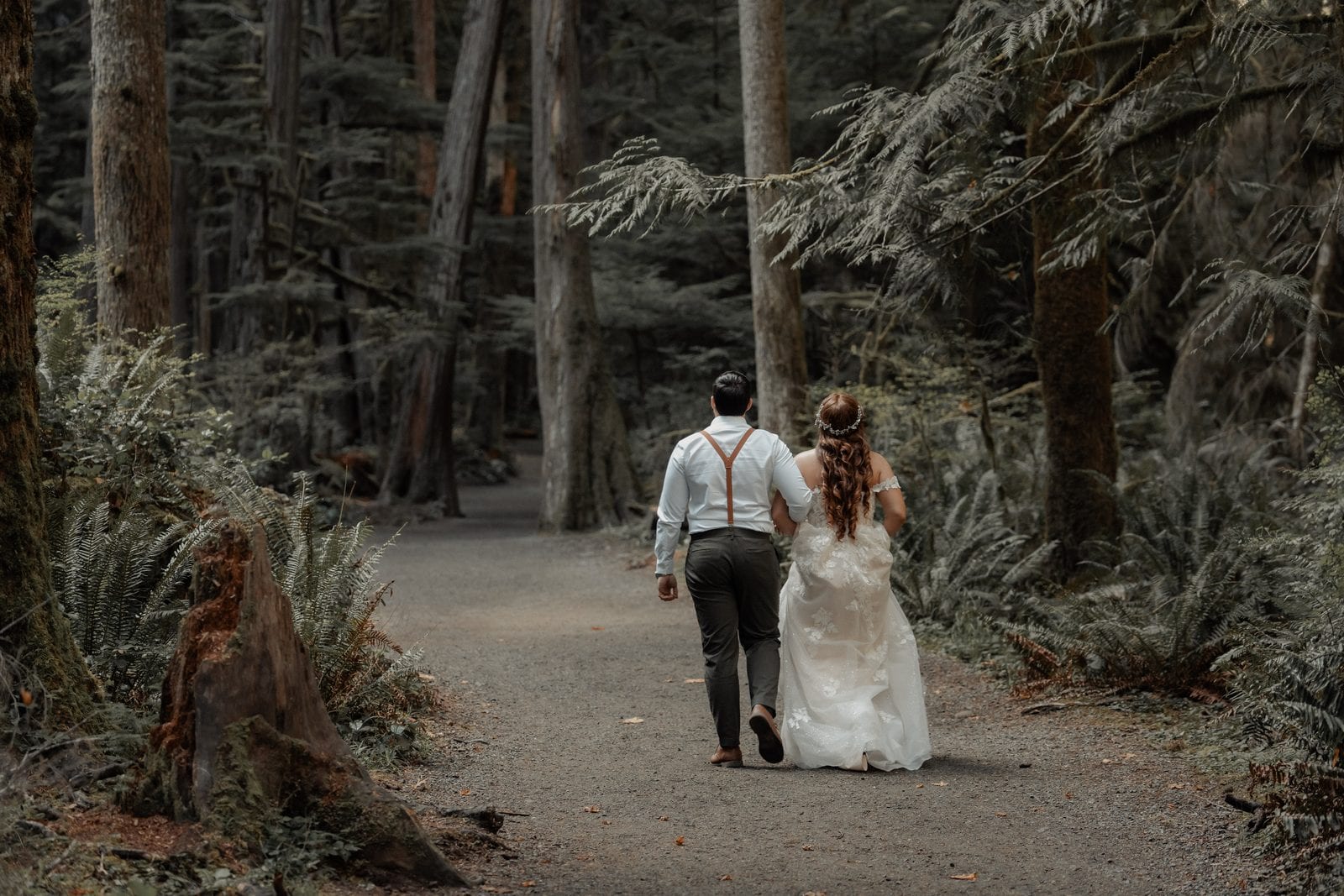 The couple walking a forest path