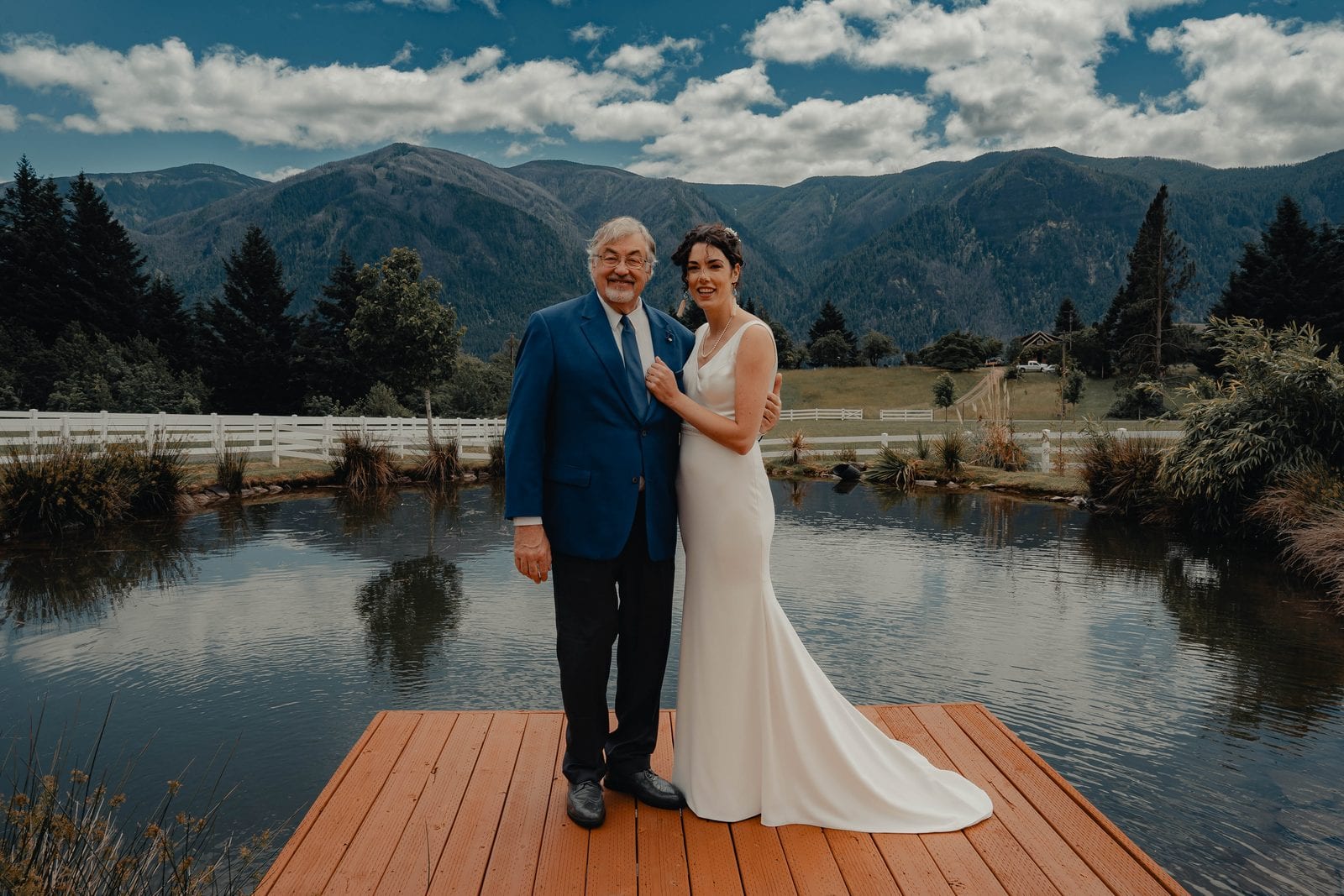 The bride with her father on the dock