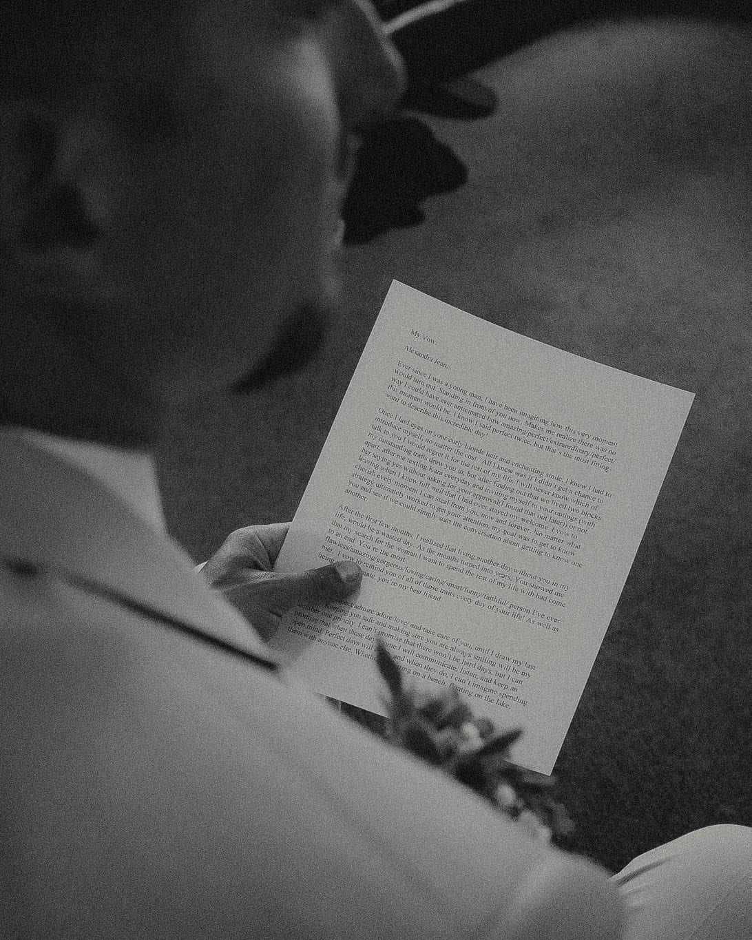The groom reading a letter before the ceremony