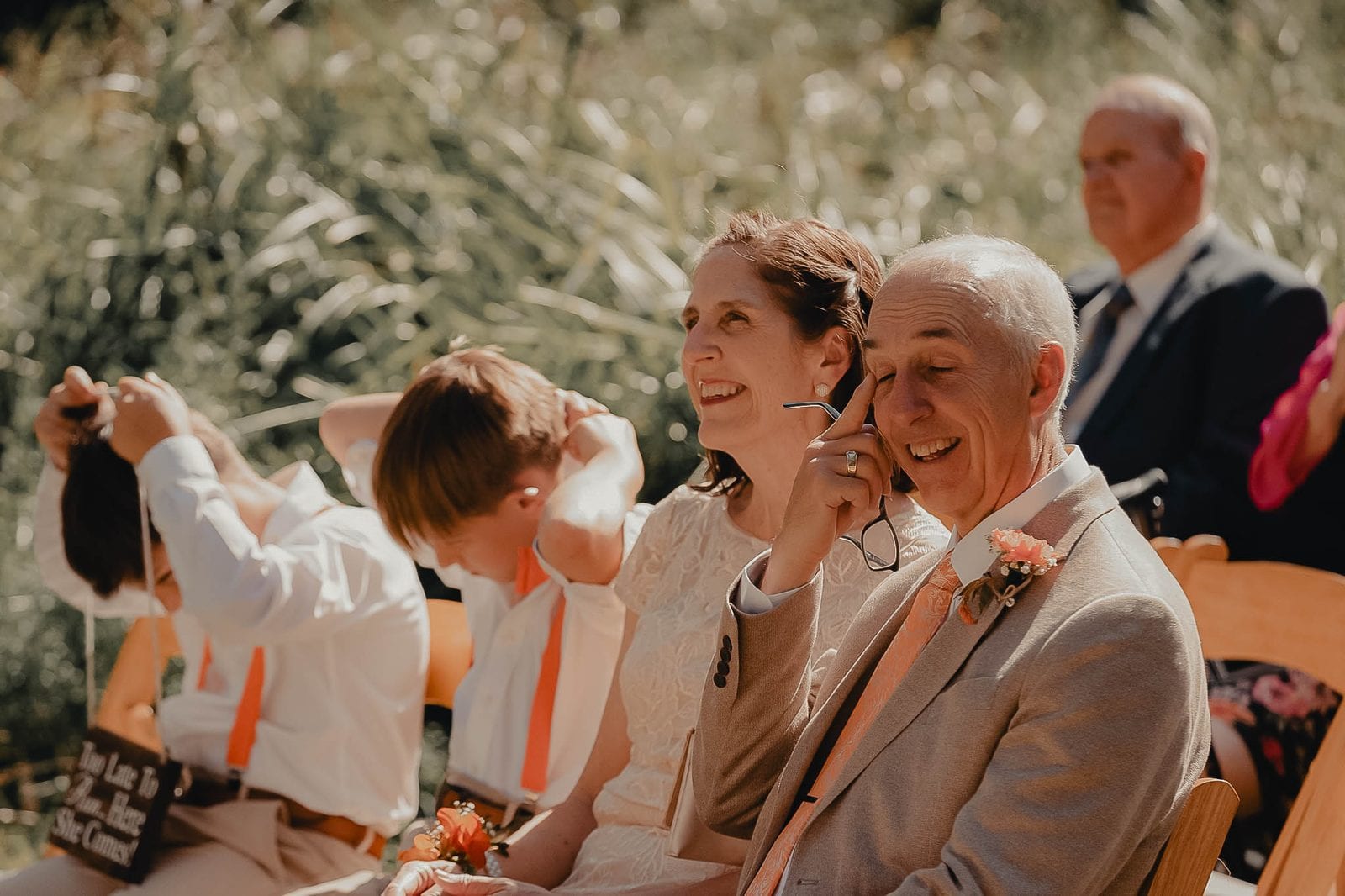 Guests laughing during the ceremony