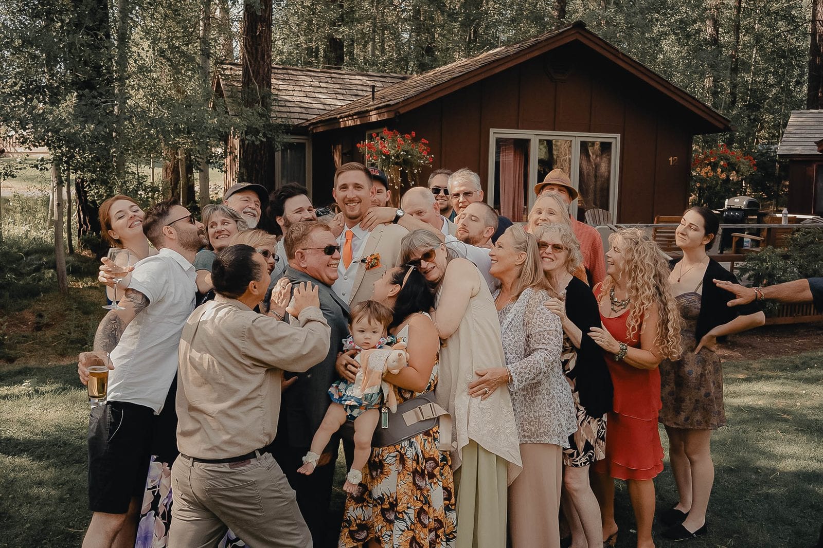 A big group hug with all the guests